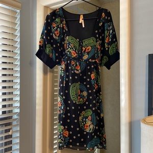 Excellent condition. Dry clean only. 100% silk shell; lining is taffeta.